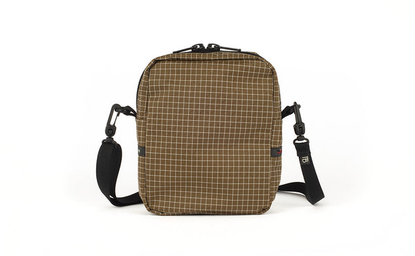 A back view of the Everyday Cubelet in Coyote Halcyon (brown with a white grid) showing a completely fabric back.